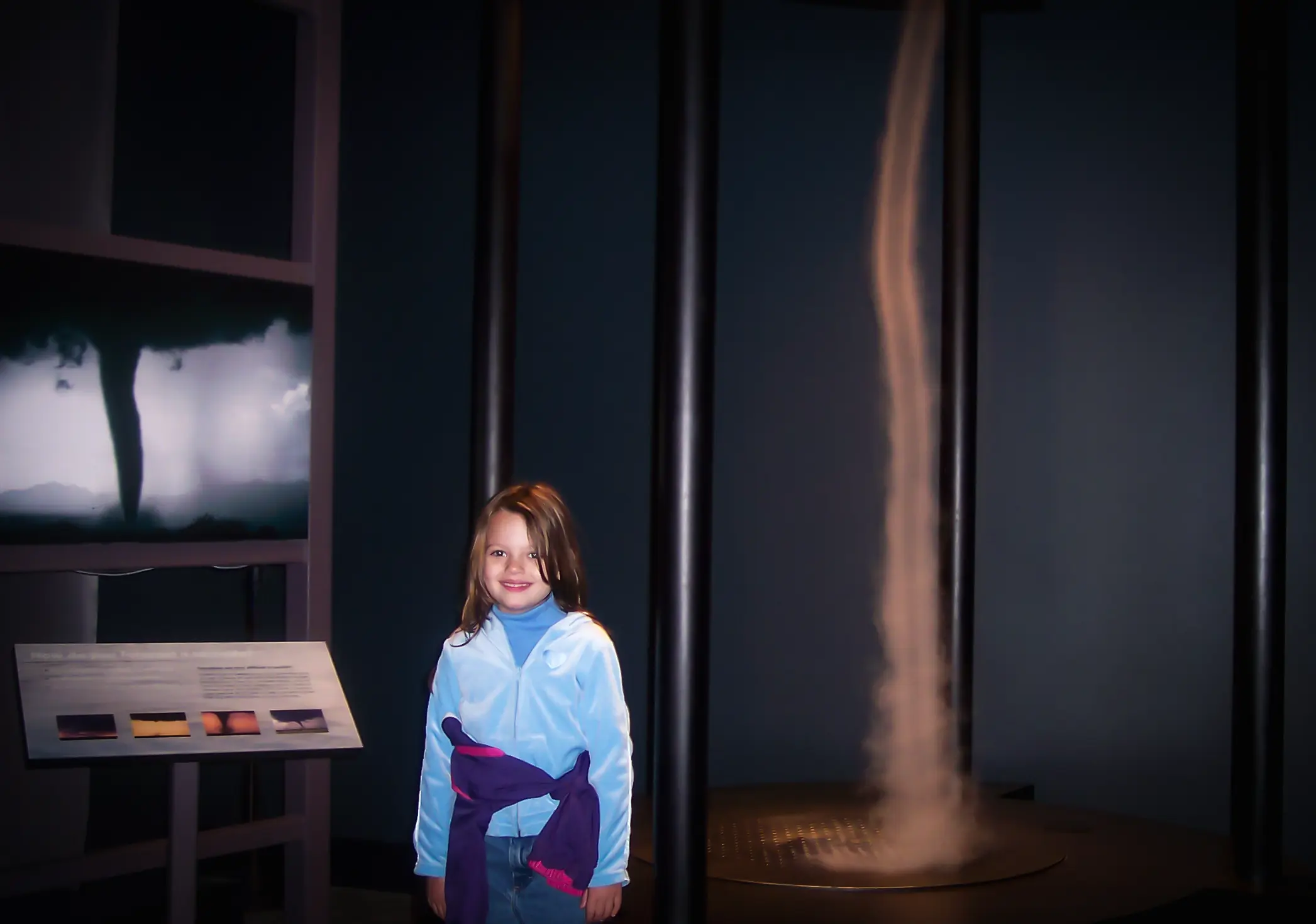 katie standing at a tornado display at the maryland science center